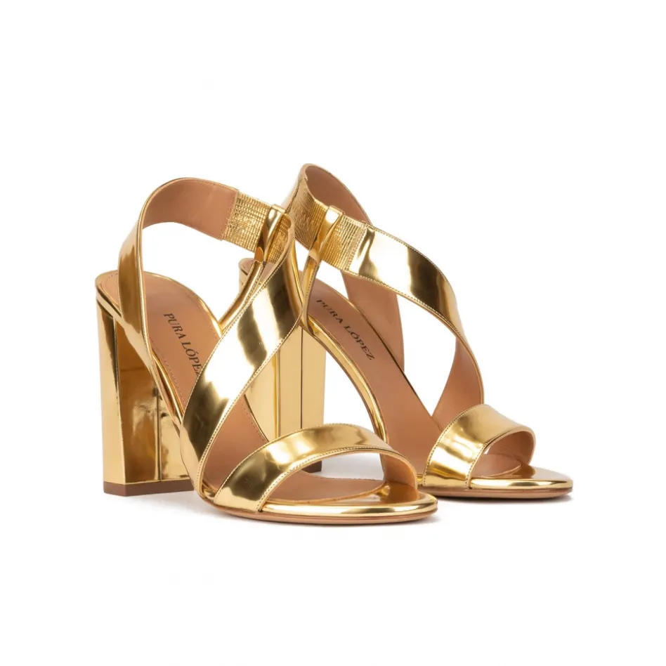 Aquira Gold strappy high block heel sandals in mirrored leather