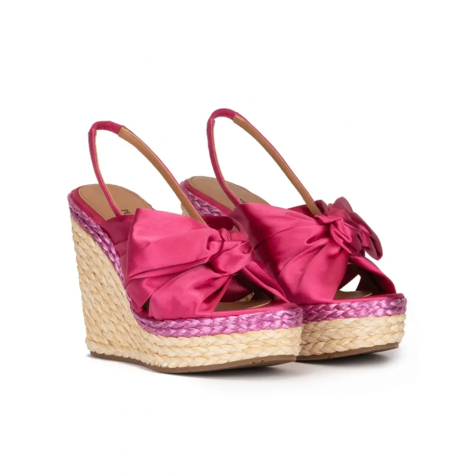 Miquela Bow detailed wedge sandals in fuchsia satin